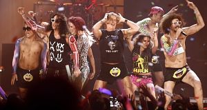 David Hasselhoff, center, dances onstage with LMFAO at the 39th Annual American Music Awards last night in Los Angeles. Pic: AP