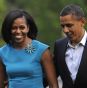 President Barack Obama walks with first lady Michelle Obama as they return to the White House yesterday.