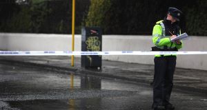 Garda and forensic officers at the scene off Blackhorse Avenue in Dublin today. Picture: PA Garda and forensic officers at the scene off Blackhorse Avenue in Dublin today. Picture: PA