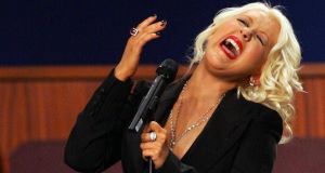 Christina Aguilera performs at the funeral of singer Etta James