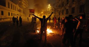 Protesters in Cairo last night. Picture: AP Protesters in Cairo last night. Picture: AP