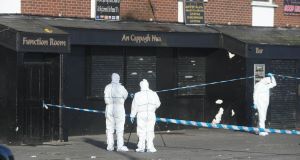 Forensic officers at the scene of the Cappagh Nua pub in the Finglas area of north Dublin today.