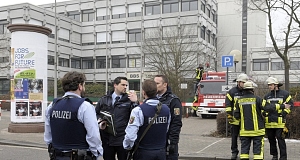 Police and firefighters stand in front of the school in Ludwigshafen, Germany. Pic: AP Police and firefighters stand in front of the school in Ludwigshafen, Germany. Pic: AP
