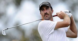 Geoff Ogilvy of Australia plays a tee shot during the third round of the Australian Masters golf tournament at Victoria Golf Club in Melbourne today.
