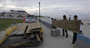 Town workers, from right, Jose Pineda, Travis Thompson, and Cager Jones, install barriers on the boardwalk as Hurricane Earl heads toward the eastern coast in Atlantic Beach, North Carolina. Pic: AP Town workers, from right, Jose Pineda, Travis Thompson, and Cager Jones, install barriers on the boardwalk as Hurricane Earl heads toward the eastern coast in Atlantic Beach, North Carolina. Pic: AP