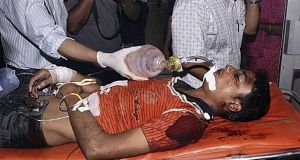 Medical staff carry a blast victim for treatment at Gauhati Medical College Hospital in Gauhati, India, today. Pic: AP Medical staff carry a blast victim for treatment at Gauhati Medical College Hospital in Gauhati, India, today. Pic: AP