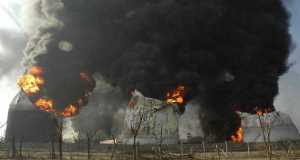 Smoke and flames rise out of oil storage tanks at an oil depot in Jaipur, India, today.