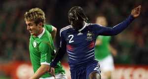 Frances Bacary Sagna and Irelands Kevin Doyle (left) battle for the ball.