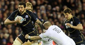 Scotlands Jim Hamilton is tackled by Englands Dan Cole during todays match.