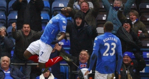 John Utaka, left, celebrates scoring his second for Portsmouth. John Utaka, left, celebrates scoring his second for Portsmouth.