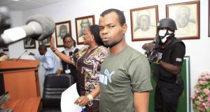 Kabiru Sokoto, who police accuse of masterminding the Christmas Day bombing of a Catholic church in Nigeria, appears before journalists during a news conference
