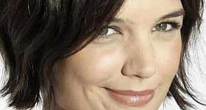 Katie Holmes narrowly avoided serious injury after a car caught fire on a movie set.