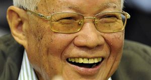Khieu Samphan, former Khmer Rouge head of state smiles during the second day of the trial of the former Khmer Rouge top leaders. Khieu Samphan, former Khmer Rouge head of state smiles during the second day of the trial of the former Khmer Rouge top leaders.