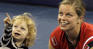 Kim Clijsters of Belgium with her daughter Jada after winning the womens championship over Caroline Wozniacki of Denmark at the US Open.