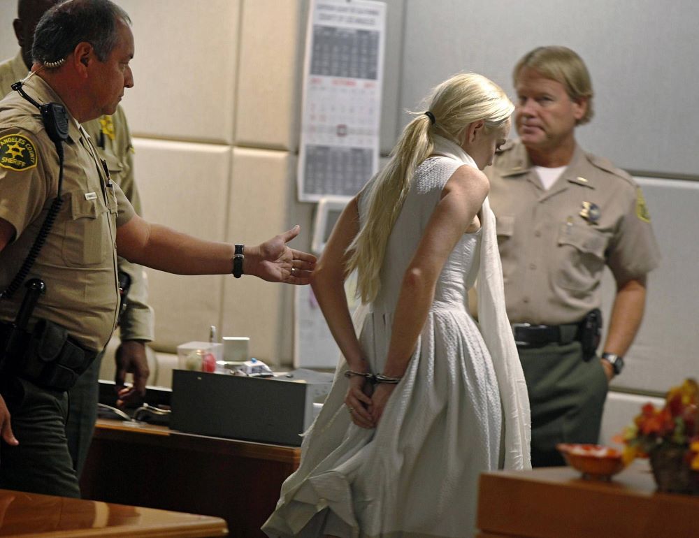 Lohan is led away in handcuffs - but bailed soon after.
