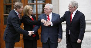 Taoiseach Enda Kenny (left) and Tanaiste Eamon Gilmore (right) hold a photocall with new ministers Joe Costello (2nd right) and Jan OSullivan (2nd left) at Government Buildings.