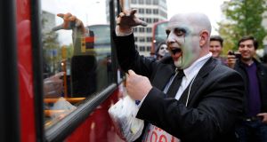 An Occupy London protester dressed as a zombie banker during a march around Londons financial district last night.