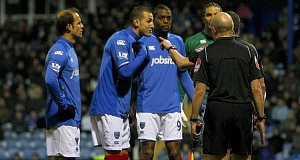 Portsmouths Hassan Yebda (2nd left) argues with the officials on the touchline after he is shown a red card during the Barclays Premier league match at Fratton Park, Portsmouth. Pic: PA