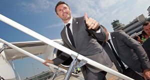 Robbie Keane boards the plane as the squad departs for the team Robbie Keane boards the plane as the squad departs for the team