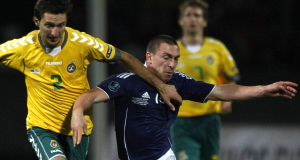 Scotlands Scott Brown battles for the ball with Lithuanias Deivdas Semberas.