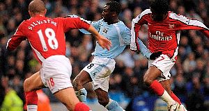 Manchester Citys Shaun Wright-Phillips (centre) comes under pressure from Arsenals Alexandre Song Billong (right) and Mikael Silvestre. Pic: PA Manchester Citys Shaun Wright-Phillips (centre) comes under pressure from Arsenals Alexandre Song Billong (right) and Mikael Silvestre. Pic: PA