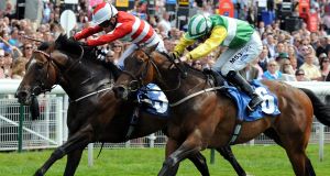 Doncaster Rover and Silvestre De Sousa (left) narrowly beat Majestic Myles and Paul Hanagan to win the Debenhams City of York Stakes during the Ebor Festival 2011 at York Racecourse.