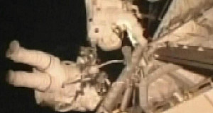In this image taken from video, space shuttle Atlantis crewmen Michael Foreman and Dr Robert Satcher, Jr, install a space antenna outside the International Space Station.