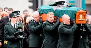 Detectives are today questioning nine people in connection with the murders of two soldiers and a police officer in the North after a series of raids where investigators seized a gun and ammunition.