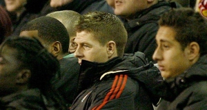 Steven Gerrard watches glumly from the stands after being substituted due to injury in last nights Champions League tie.