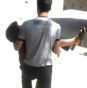 A child is carried from the scene in this image from video. A child is carried from the scene in this image from video.