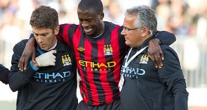 Manchester Citys Yaya Toure is helped off the field after an injury against the Vancouver Whitecaps during the first half of an international friendly soccer match in Vancouver. Manchester Citys Yaya Toure is helped off the field after an injury against the Vancouver Whitecaps during the first half of an international friendly soccer match in Vancouver.